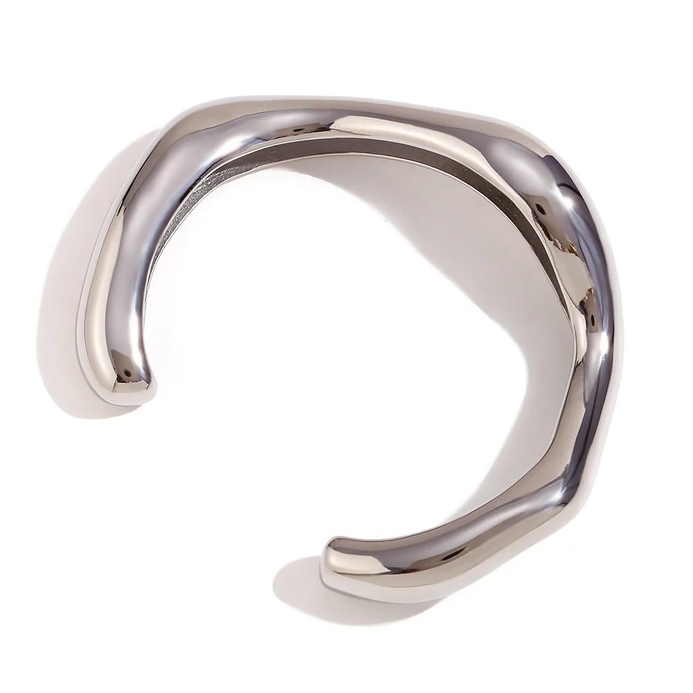 Silver ring with a modern design on a white background