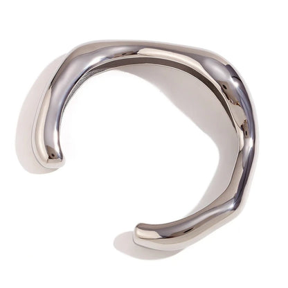 Silver ring with a modern design on a white background
