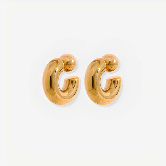 Gold hoop earrings on a white background